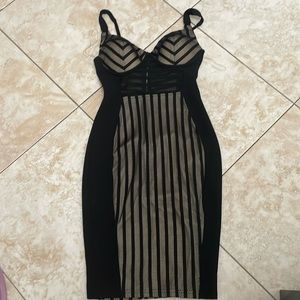 Black and tan midi dress. Long lines running down with open mesh back